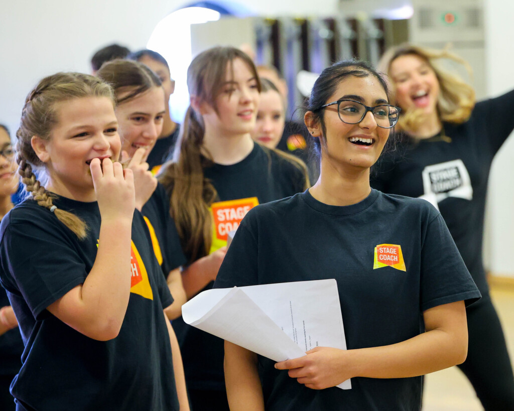 Main Stages students laughing together during a class