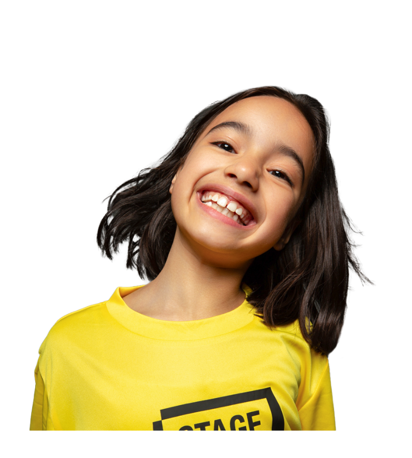 Smiling young Stagecoach student in a yellow performing arts class uniform.