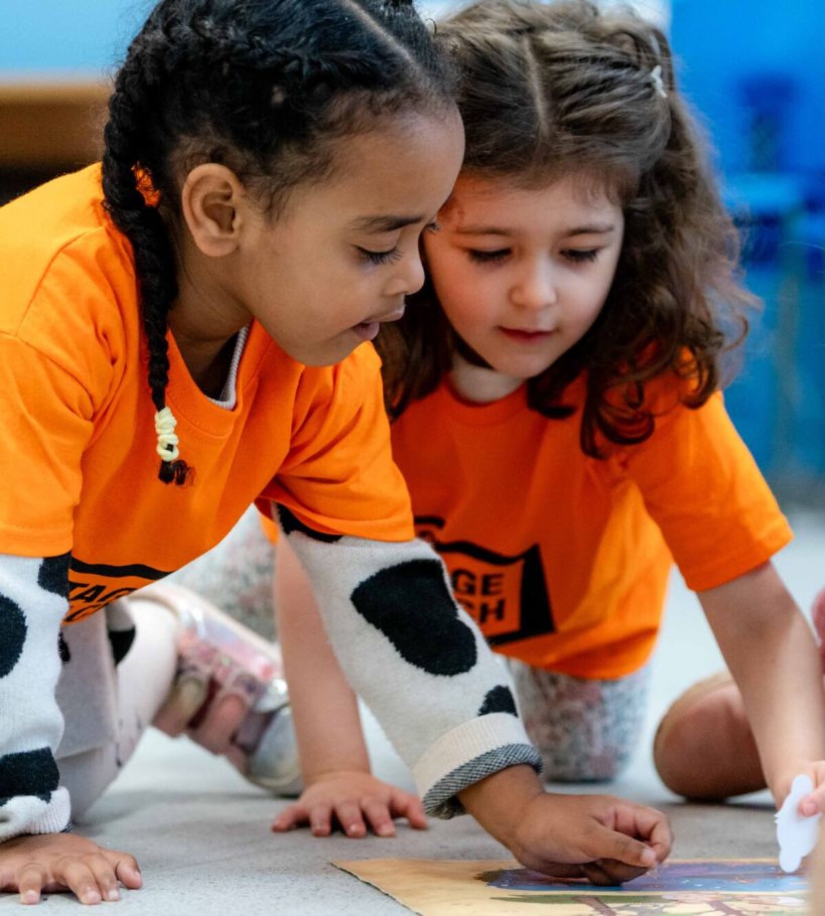 Young child enjoying a Stagecoach Mini Stages class with a parent or guardian.